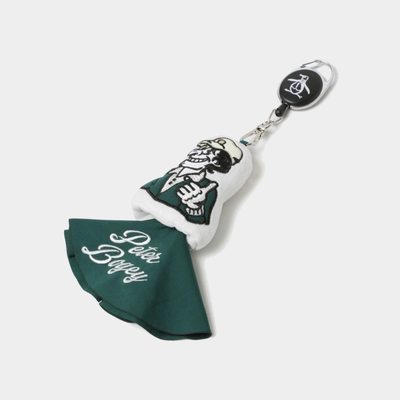 A golf club headcover keychain featuring a dark green and white fabric club cover with 'Peter Biffey' embroidered in white script, a white and black skeleton golfer graphic, and a black retractable badge reel at the top.