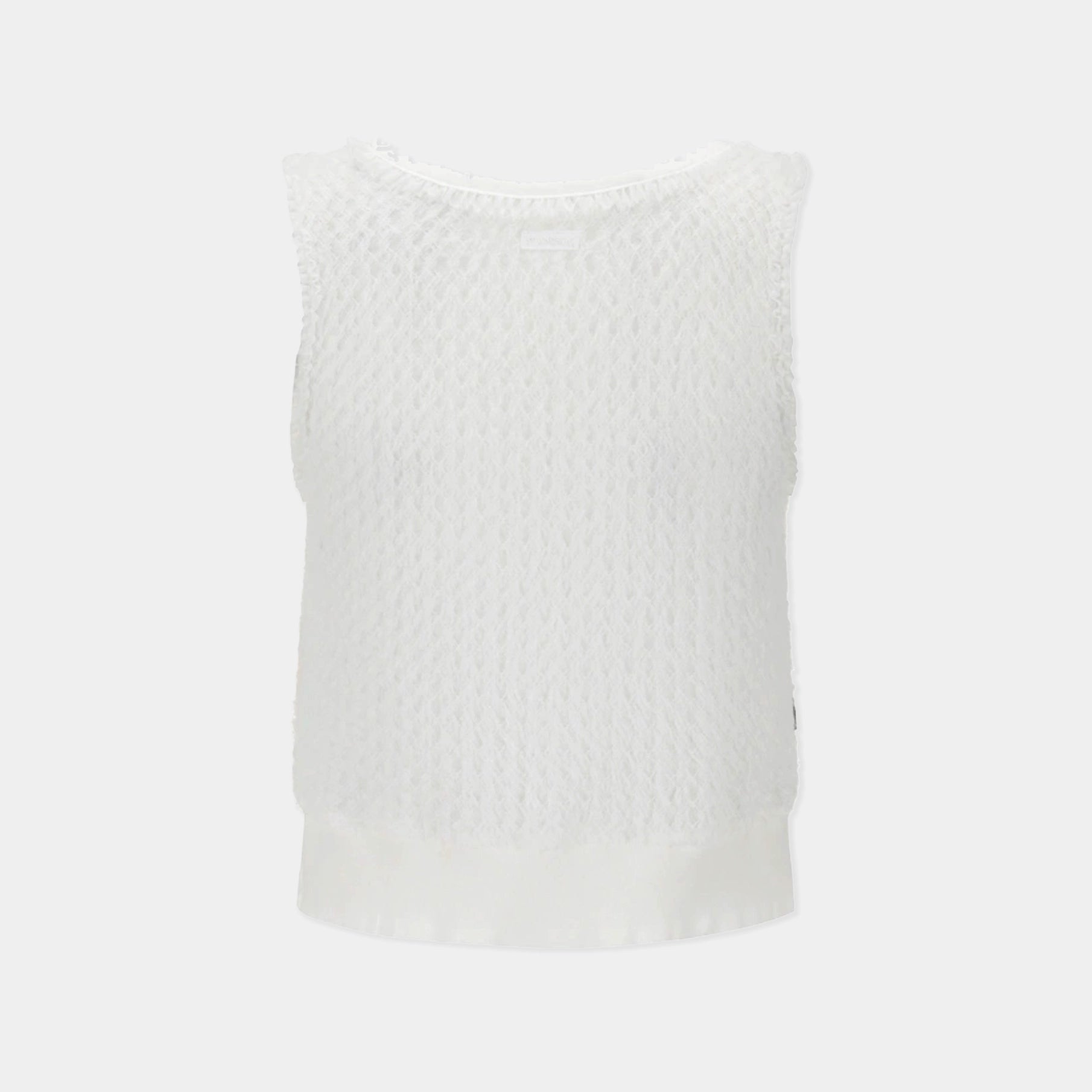 A white sleeveless knit top with a textured, openwork pattern and a solid white satin hem, shown against a light gray background.