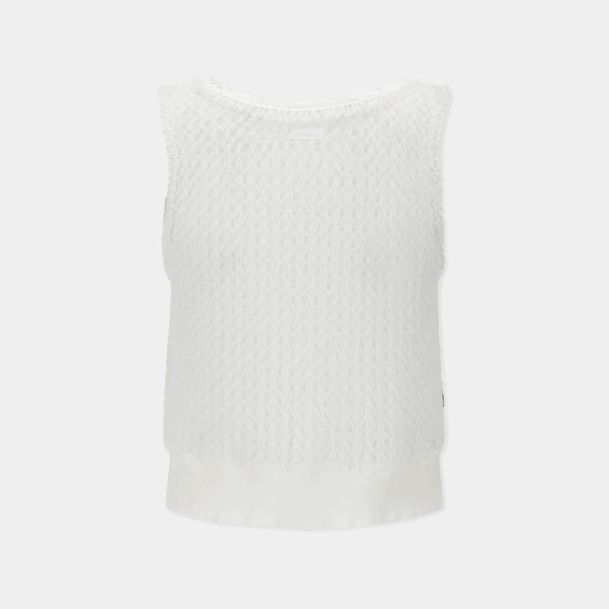 A white sleeveless knit top with a textured, openwork pattern and a solid white satin hem, shown against a light gray background.
