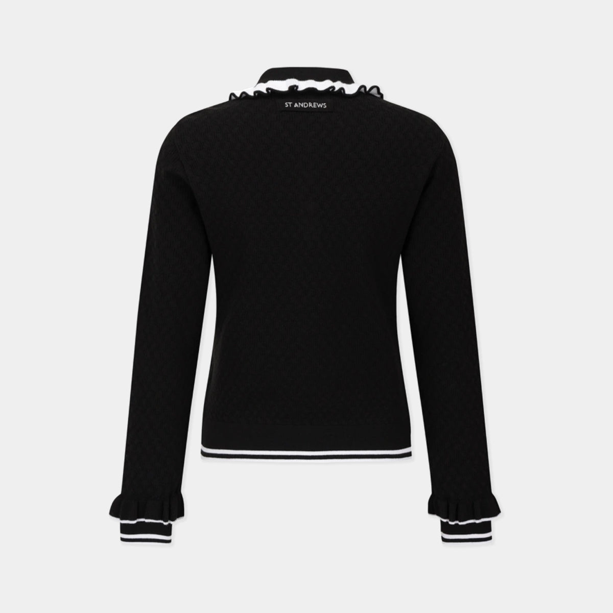 A black long-sleeve knit top with white striped accents at the ruffled collar, hem, and cuffs, shown from the back on a light gray background. The brand name 'ST ANDREWS'.