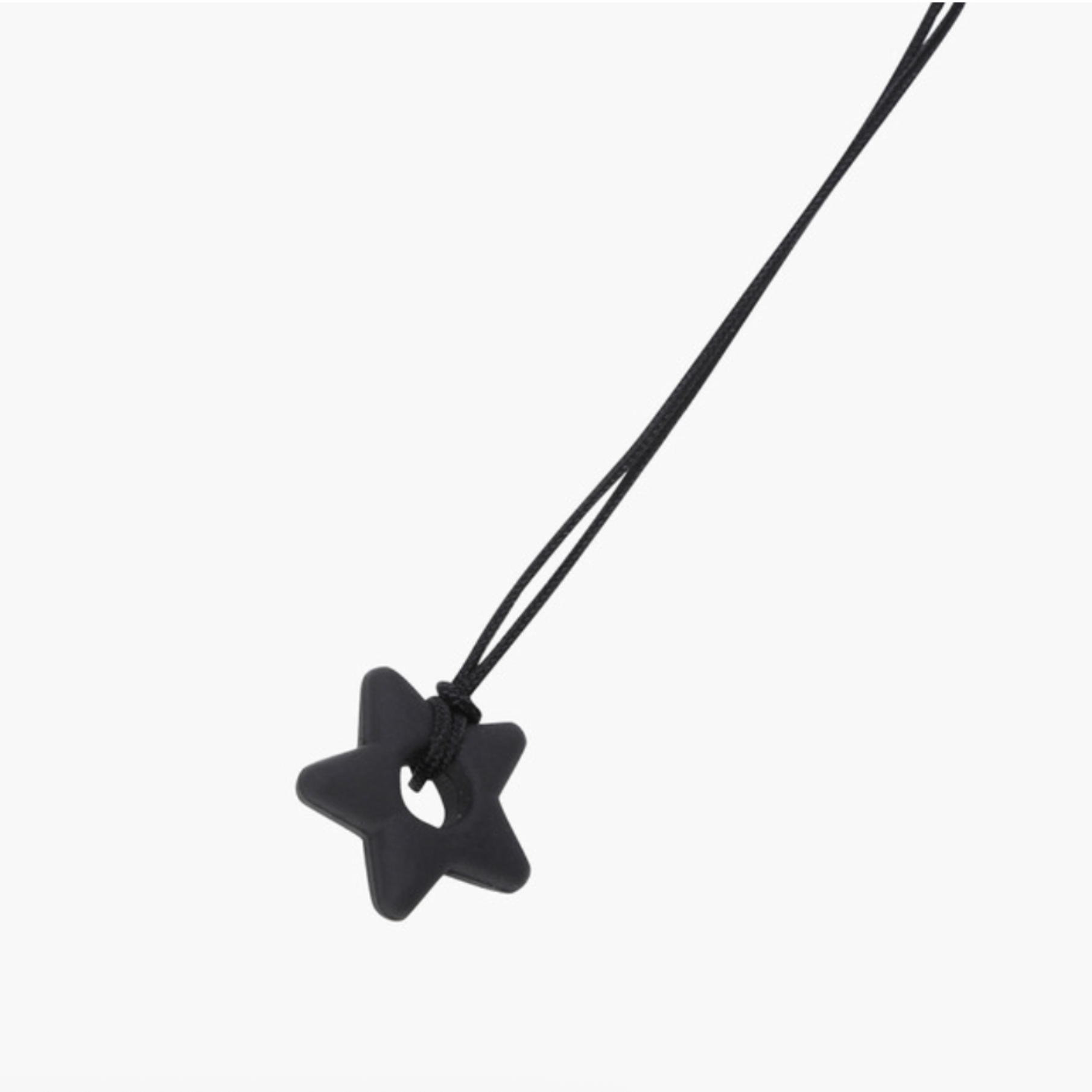 A matte black five-pointed star pendant on a matching black cord necklace, shown against a plain light gray background.