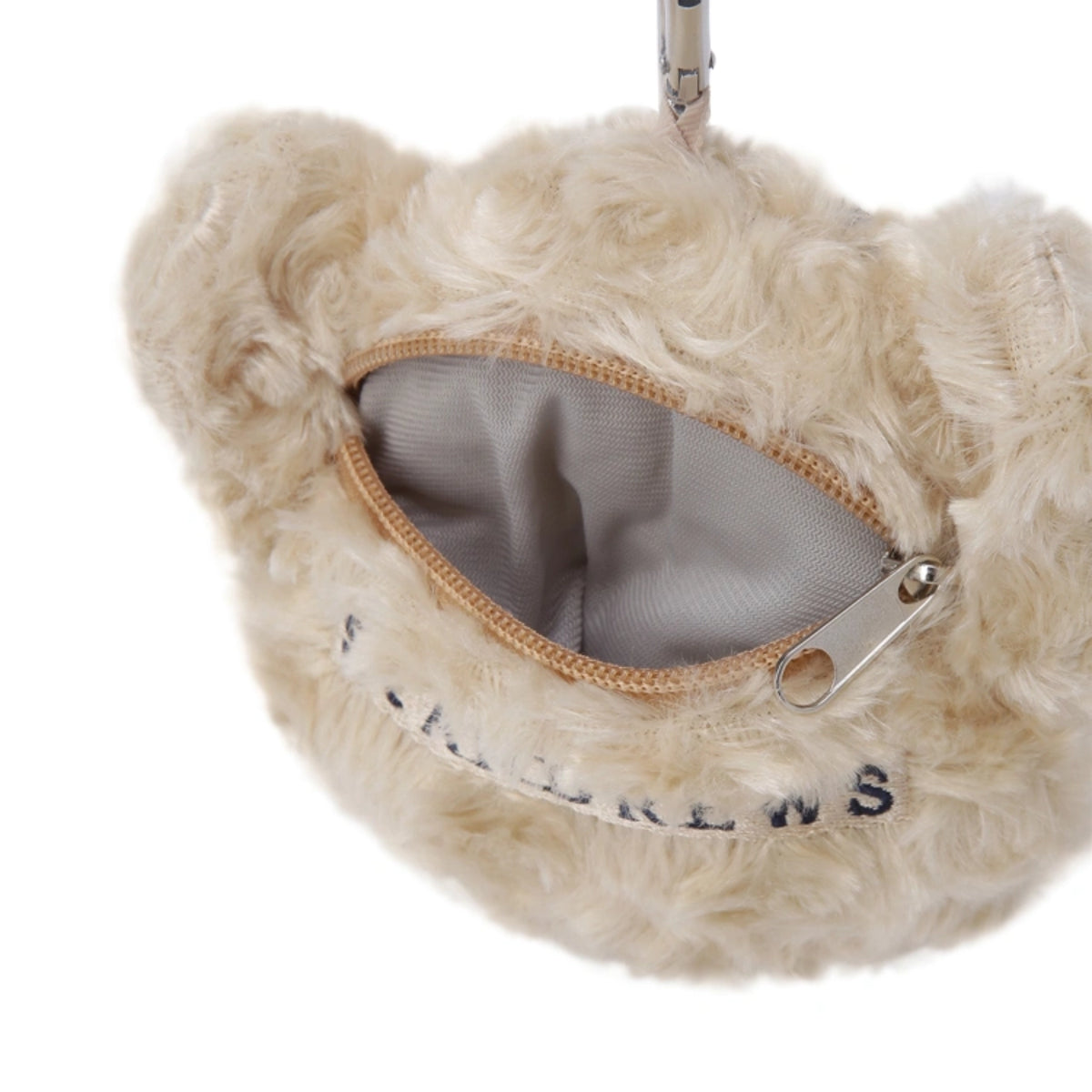 Close-up of a fluffy cream-colored faux fur pouch with an open zipper, showing a gray interior lining and silver zipper pull.