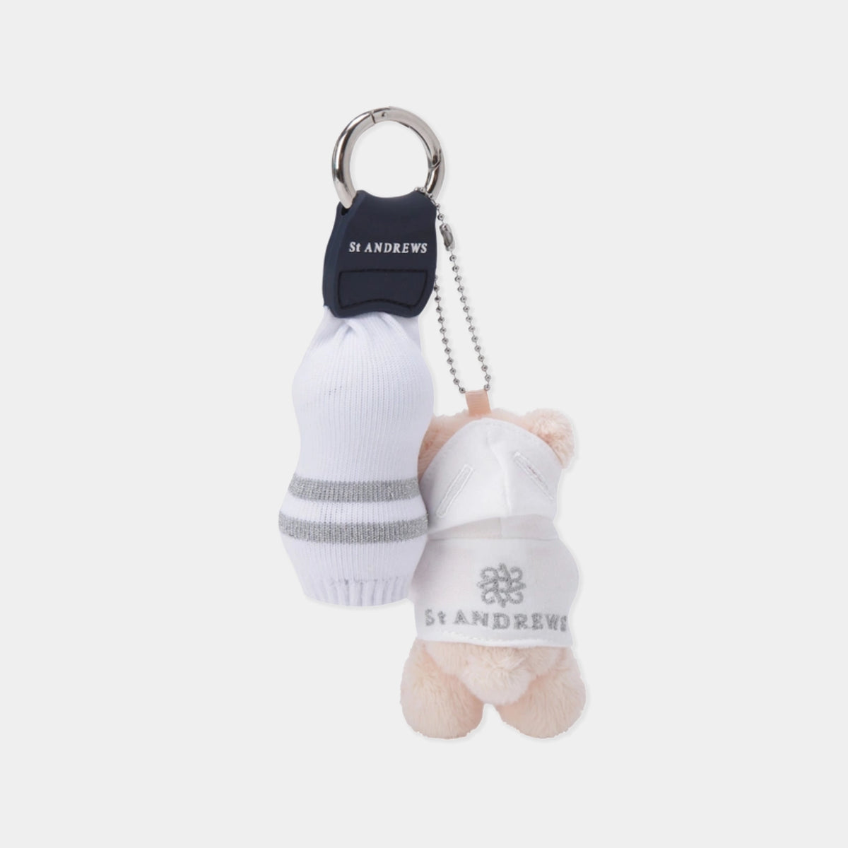 A St. Andrews themed keychain featuring a small plush teddy bear wearing a white cap with the St.