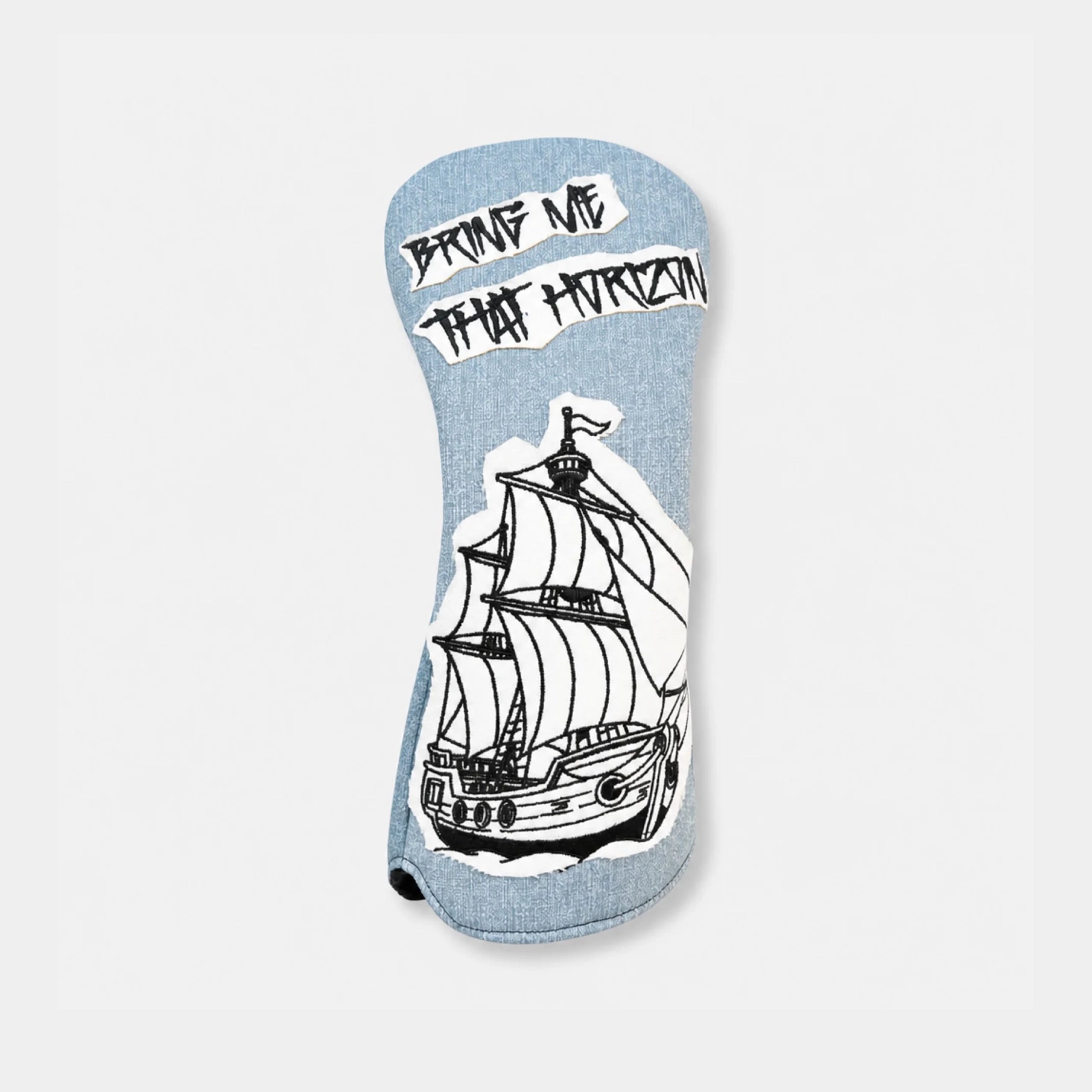 A light blue denim-textured golf club headcover featuring a black and white illustration of a sailing ship and the text 'PROVE ME THAT HORIZON' in a stylized font, shown against a plain light gray background.