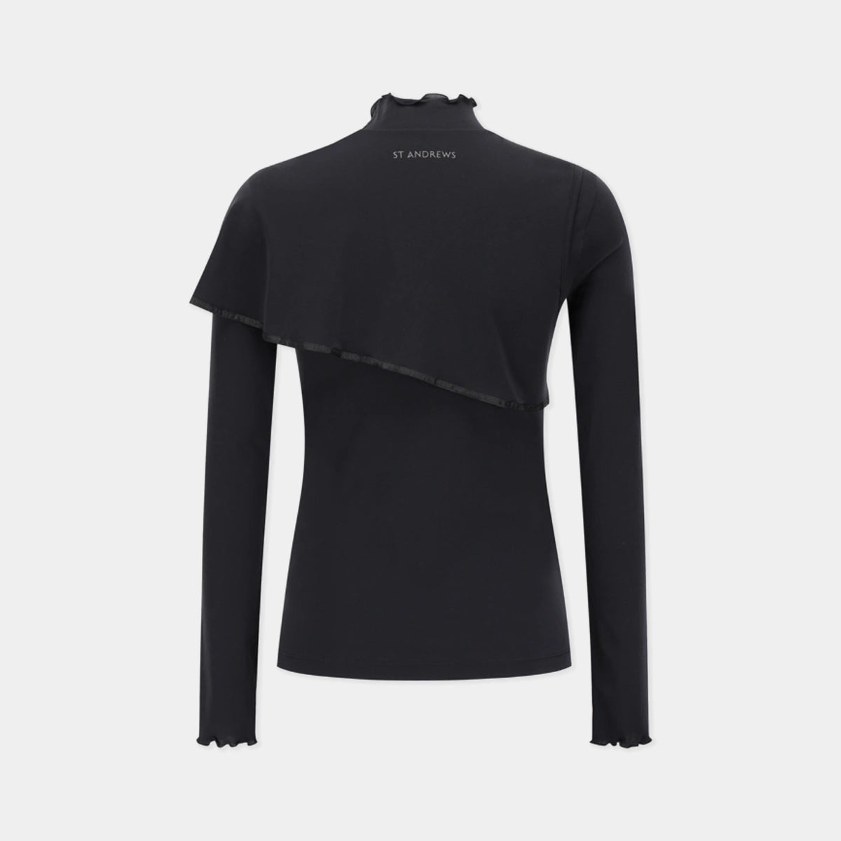 A black long-sleeve mock neck top with an asymmetrical draped overlay and ruffled edges, featuring the brand name 'ST ANDREWS' printed in white on the back of the neck, shown against a light gray background.