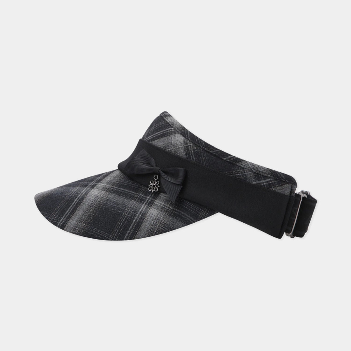 A black and gray plaid visor hat with a black bow and small silver crystal embellishment on the front, set against a light gray background.