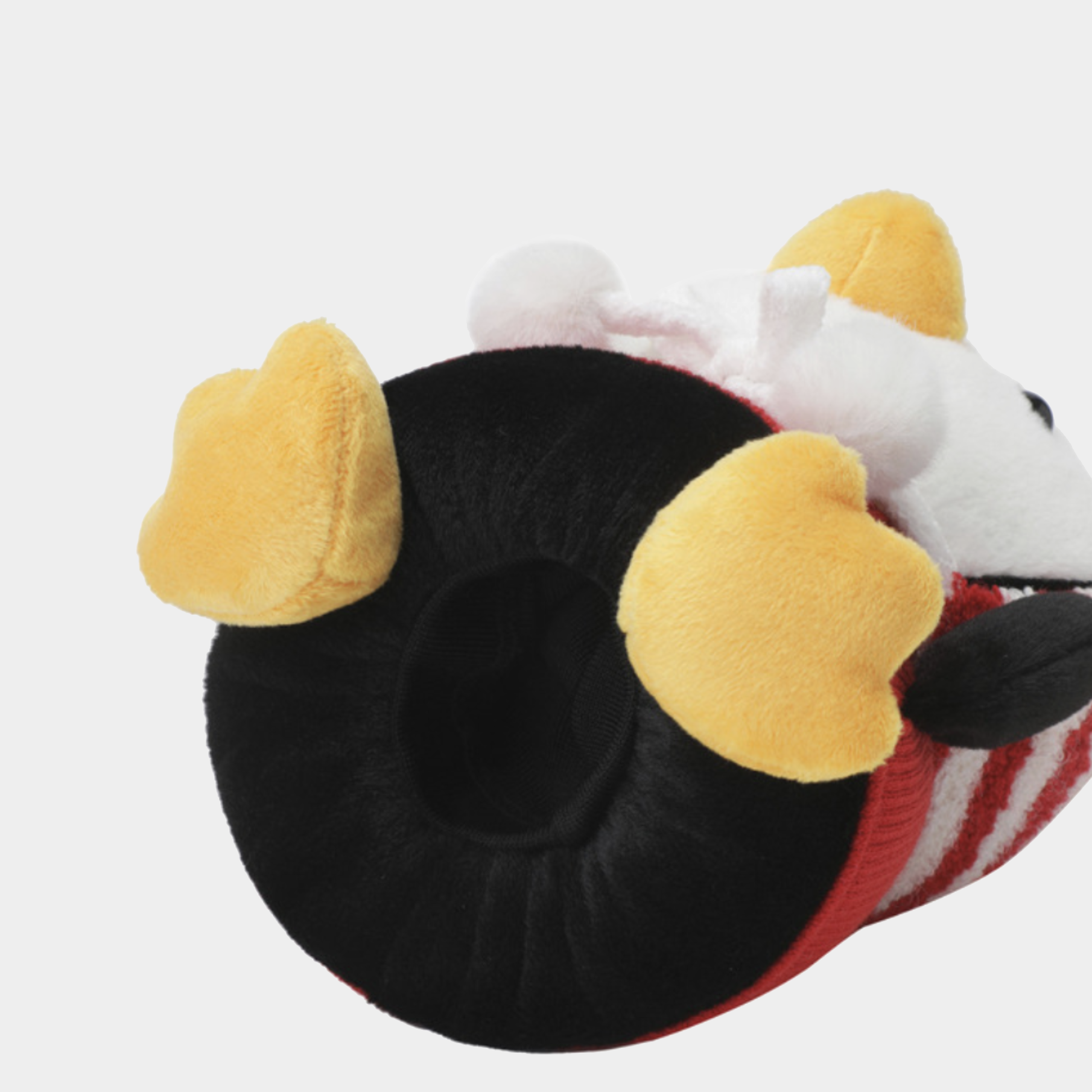 A plush penguin-themed head cover, featuring a black plush main body, yellow plush ears, a white plush face, and a red and white striped tail, shown on a light gray background.