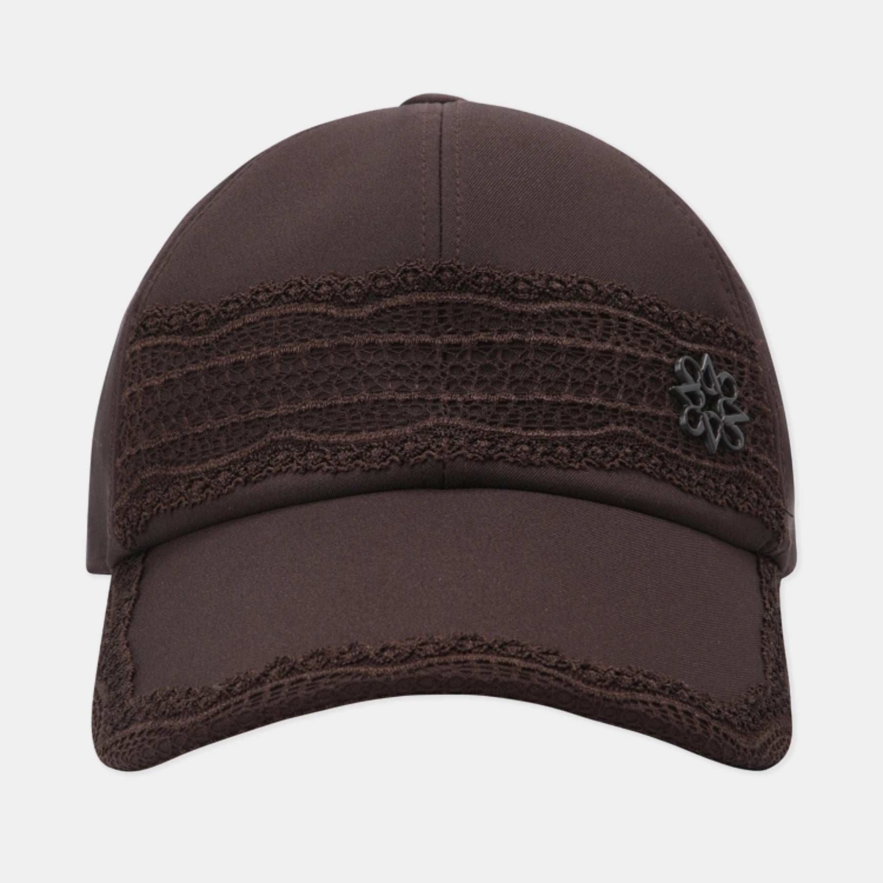 A dark brown baseball cap featuring a textured lace-like horizontal band across the front panels and a small black embroidered flower logo on the side, shown against a light gray background.