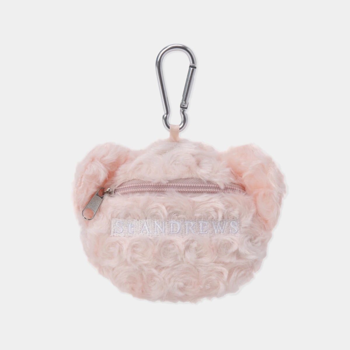 A light pink fluffy teddy bear-shaped zippered pouch with a silver carabiner clip, featuring the brand name 'ST ANDREWS' embroidered on the front, set against a plain light gray background.