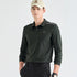 A man wearing a dark forest green long-sleeve polo shirt with white shoulder stripes and a small &