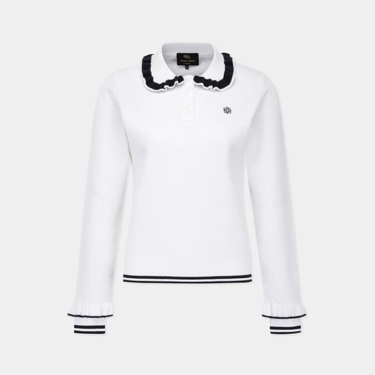 A white long-sleeve knit polo-style top with a ruffled black-and-white collar, black horizontal trim at the hem, and black-and-white striped cuffs, shown on a light gray background.