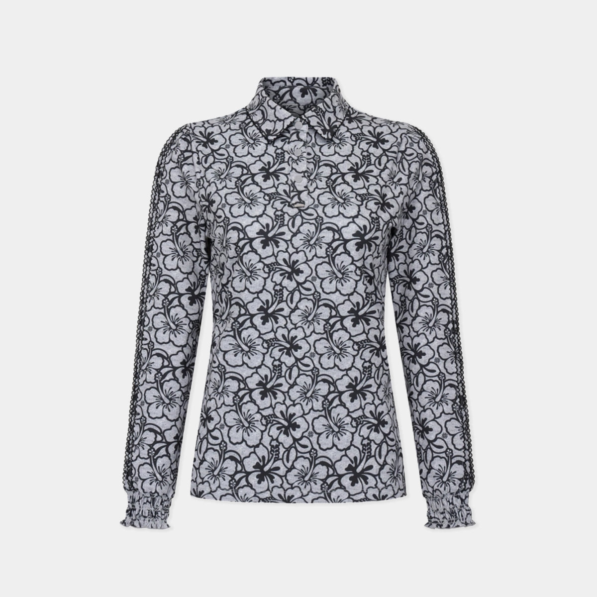 A long-sleeve collared blouse with a black floral lace overlay pattern on a light gray base, displayed on a ghost mannequin against a light gray background.