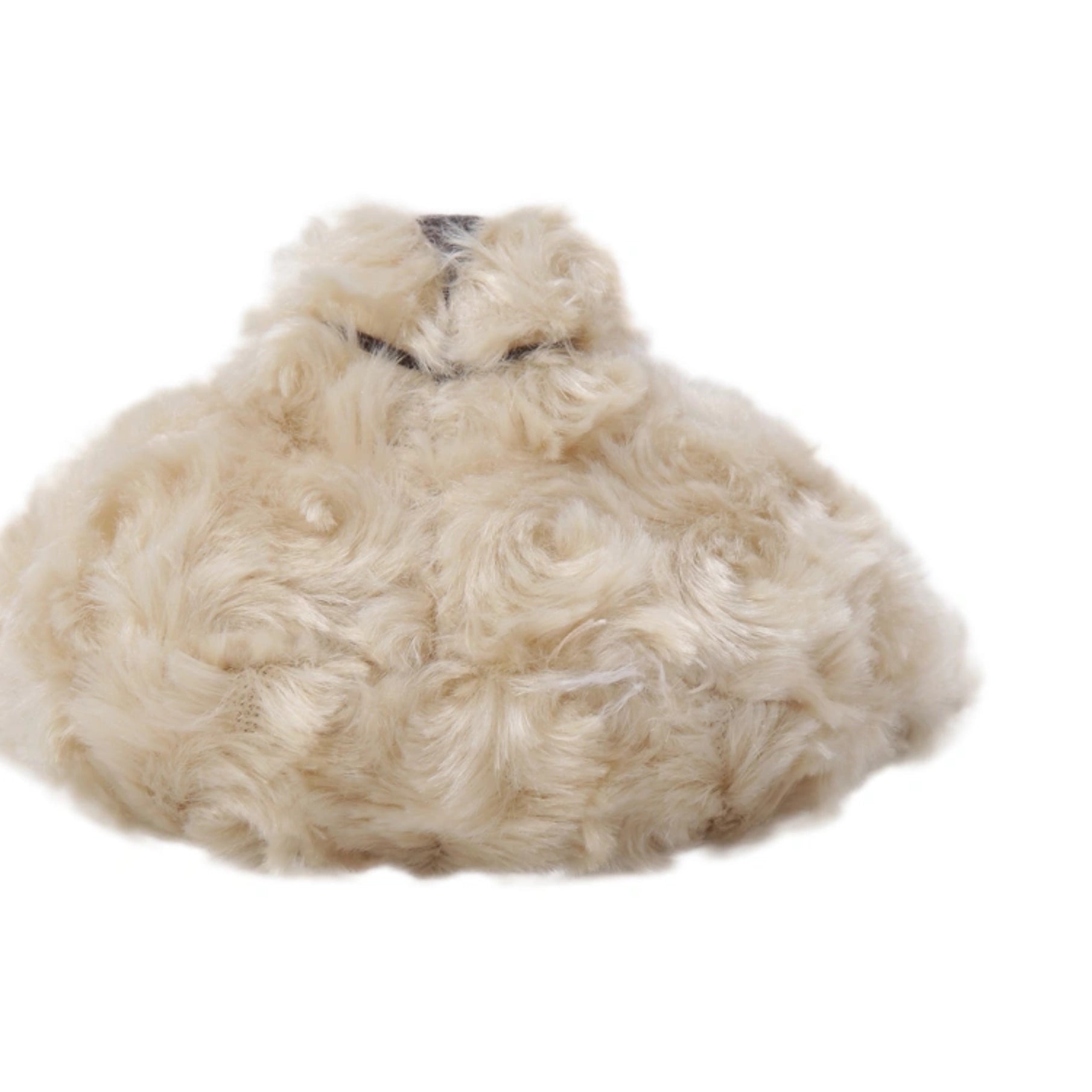 A fluffy, curly cream-colored sheepskin or wool pet bed with a small black collar, isolated on a white background.