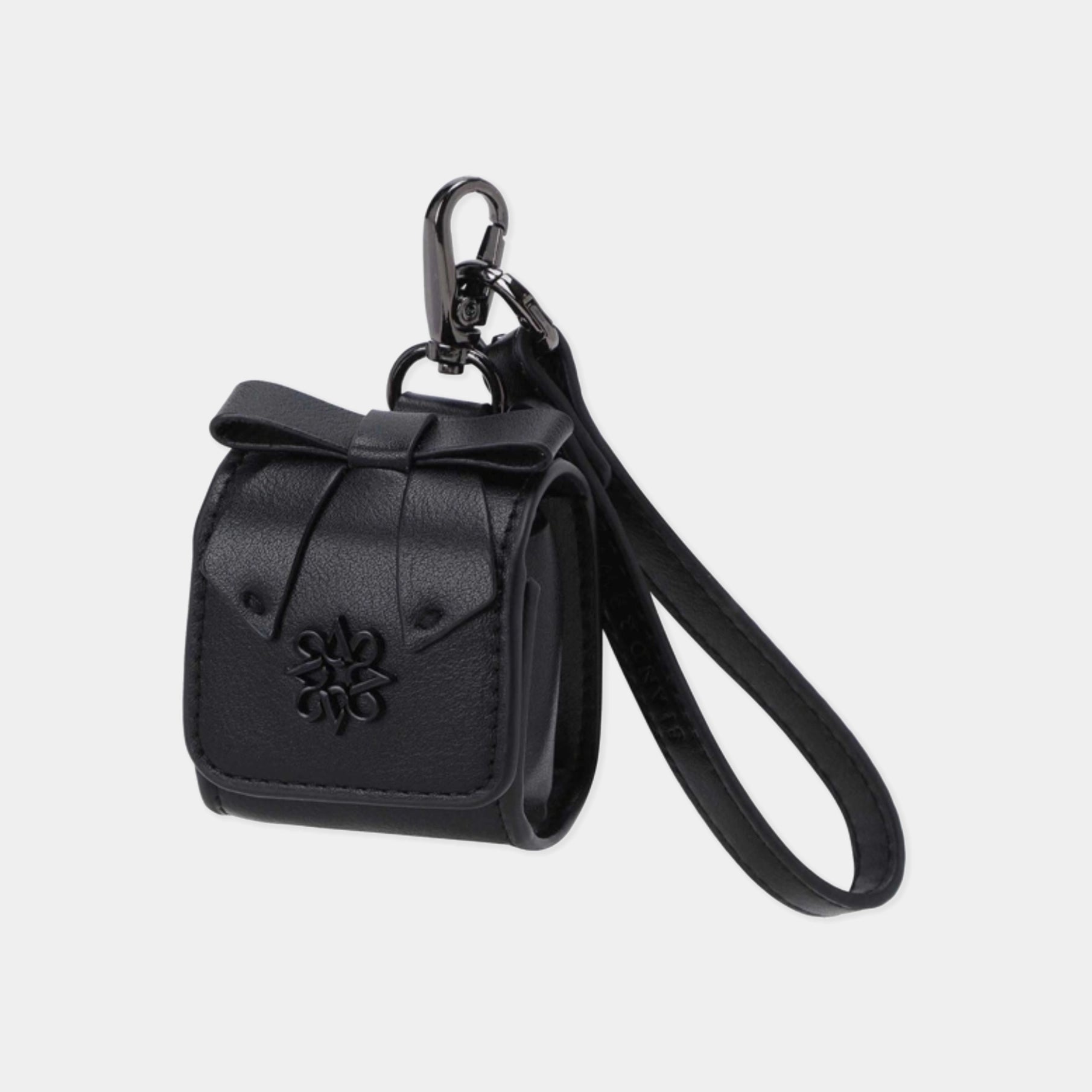 A black faux leather car key case with a bow detail, a wrist strap, and a black metal carabiner, shown on a light gray background.