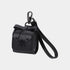 A black faux leather car key case with a bow detail, a wrist strap, and a black metal carabiner, shown on a light gray background.