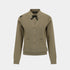A taupe knit cardigan sweater with a black bow at the collar, button-front closure, and front patch pockets, shown on a light gray background.