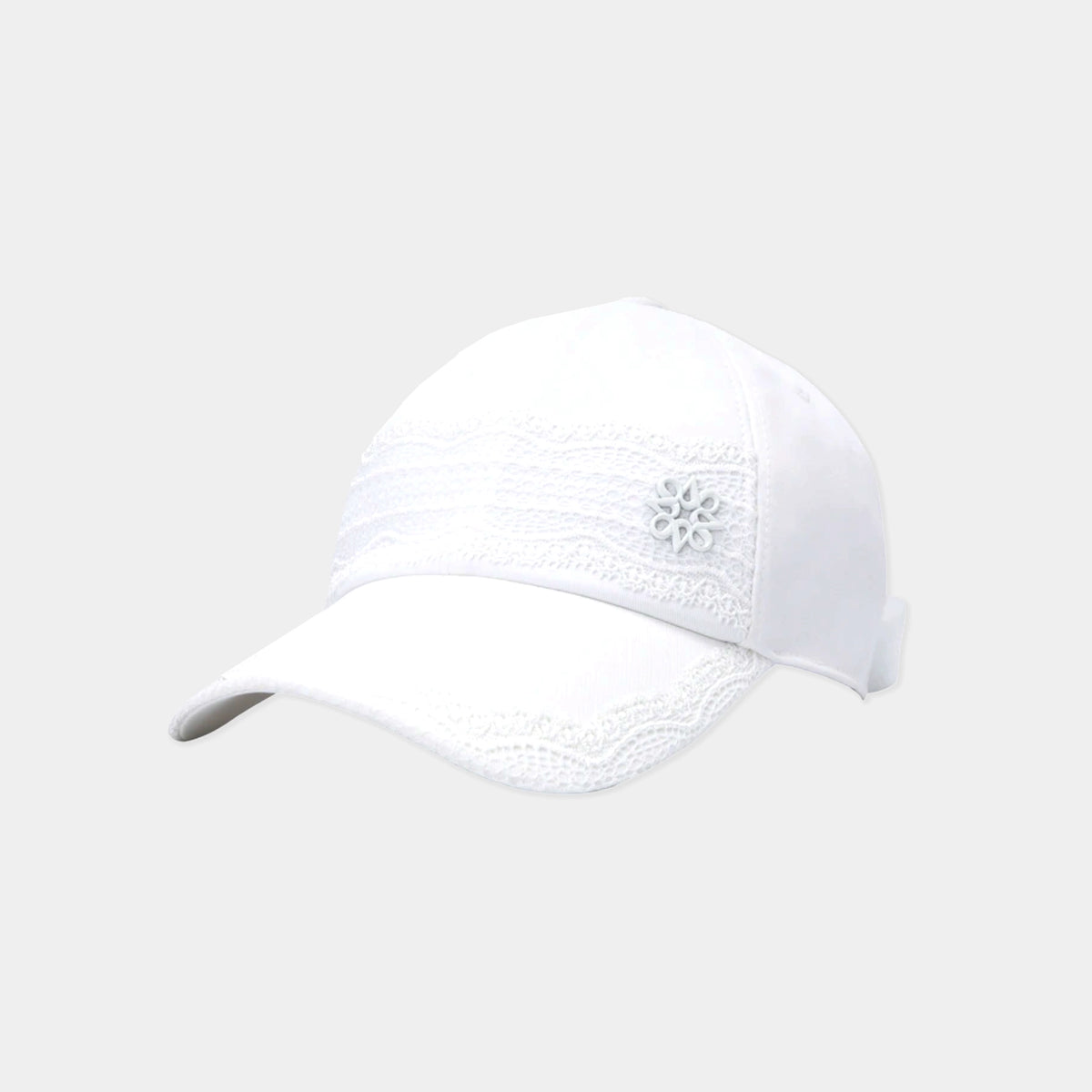 A white baseball cap featuring delicate white lace trim across the front panels and brim, with a small white embroidered flower detail on the side, set against a solid light gray background.