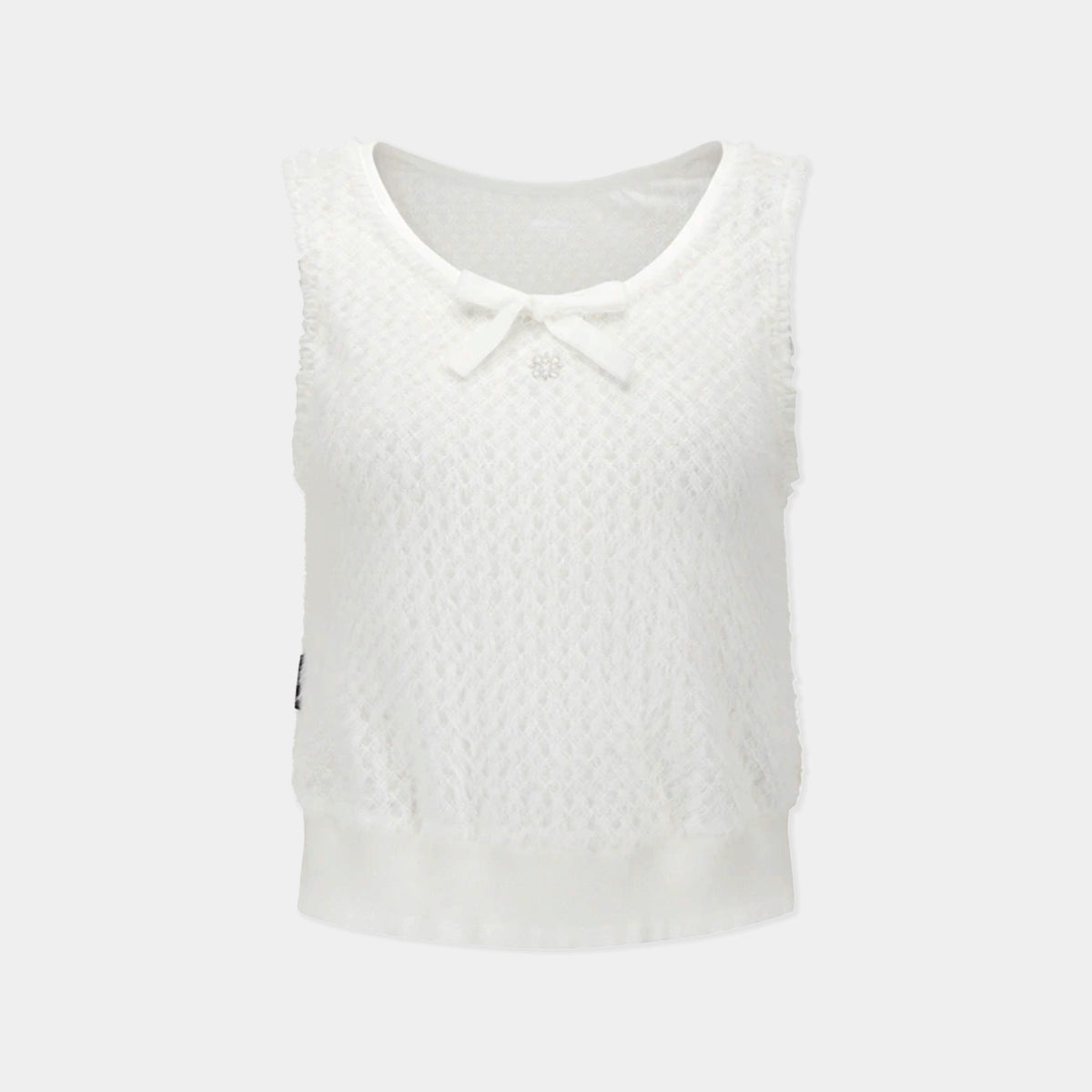 A sleeveless white knit top with a textured pattern, a scoop neckline, a small bow detail at the center, and a ruffled hem, shown against a light gray background.