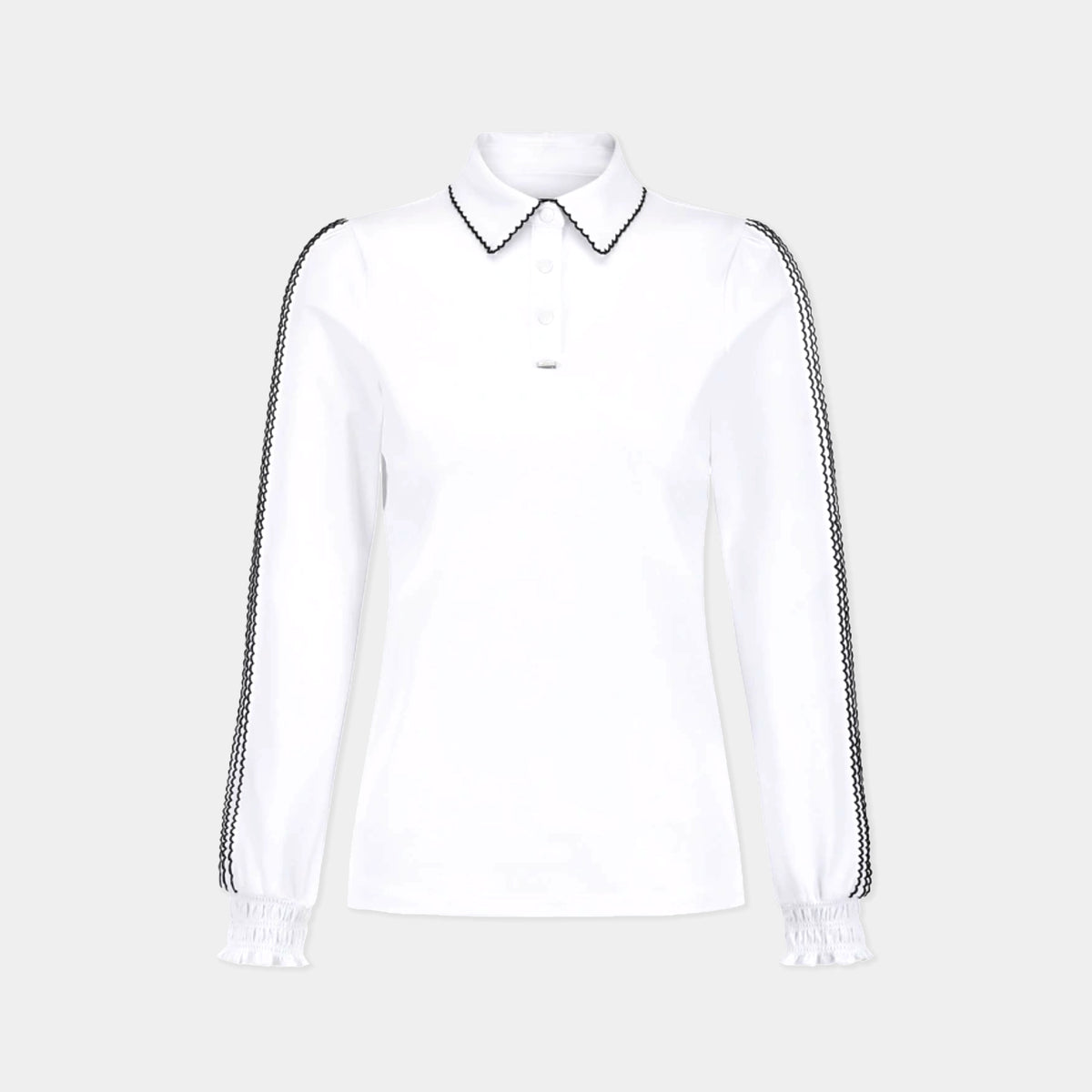 A white long-sleeve polo shirt with black-and-white patterned trim on the collar and down the sleeves, featuring a buttoned placket and elasticized cuffs, shown against a light gray background.