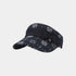 A dark navy blue visor hat featuring a white snowflake and dot pattern, accented with a matching fabric bow on the front, set against a plain light gray background.