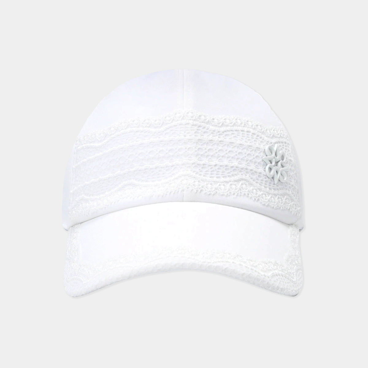A white baseball cap featuring a decorative white lace band across the front and a small white embroidered flower on the side, set against a light gray background.