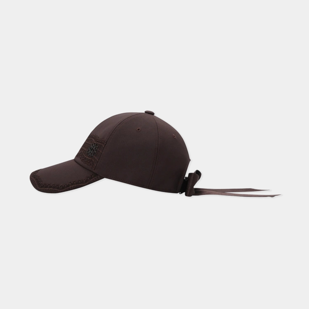 A dark brown baseball cap with a curved brim, featuring a small embroidered logo on the side and a matching dark brown chin strap with a plastic adjuster, shown against a light gray background.