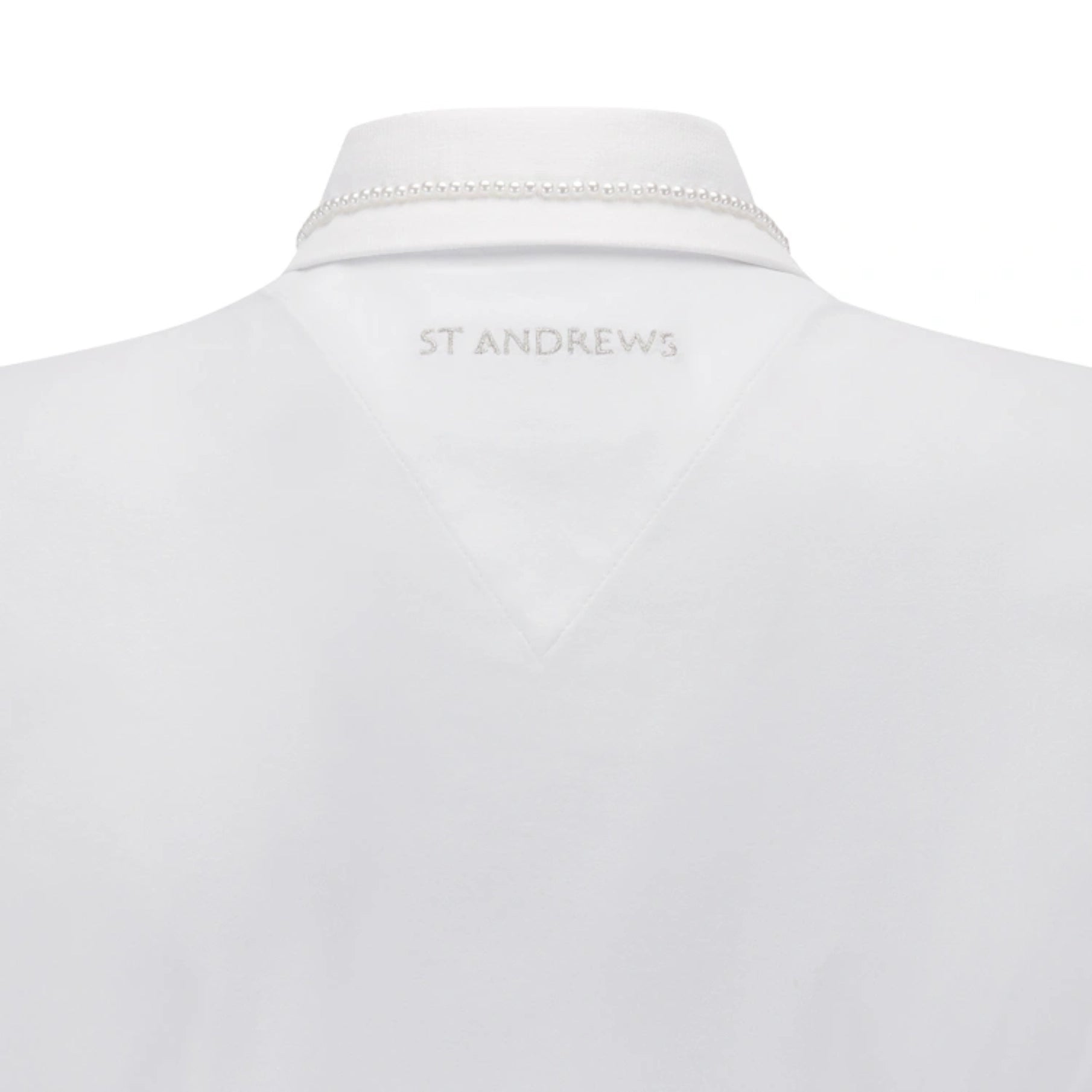 Close-up back view of a white collared shirt with a pearl-like beaded collar trim and 'ST ANDREWS' embroidered in gray at the inner neck.