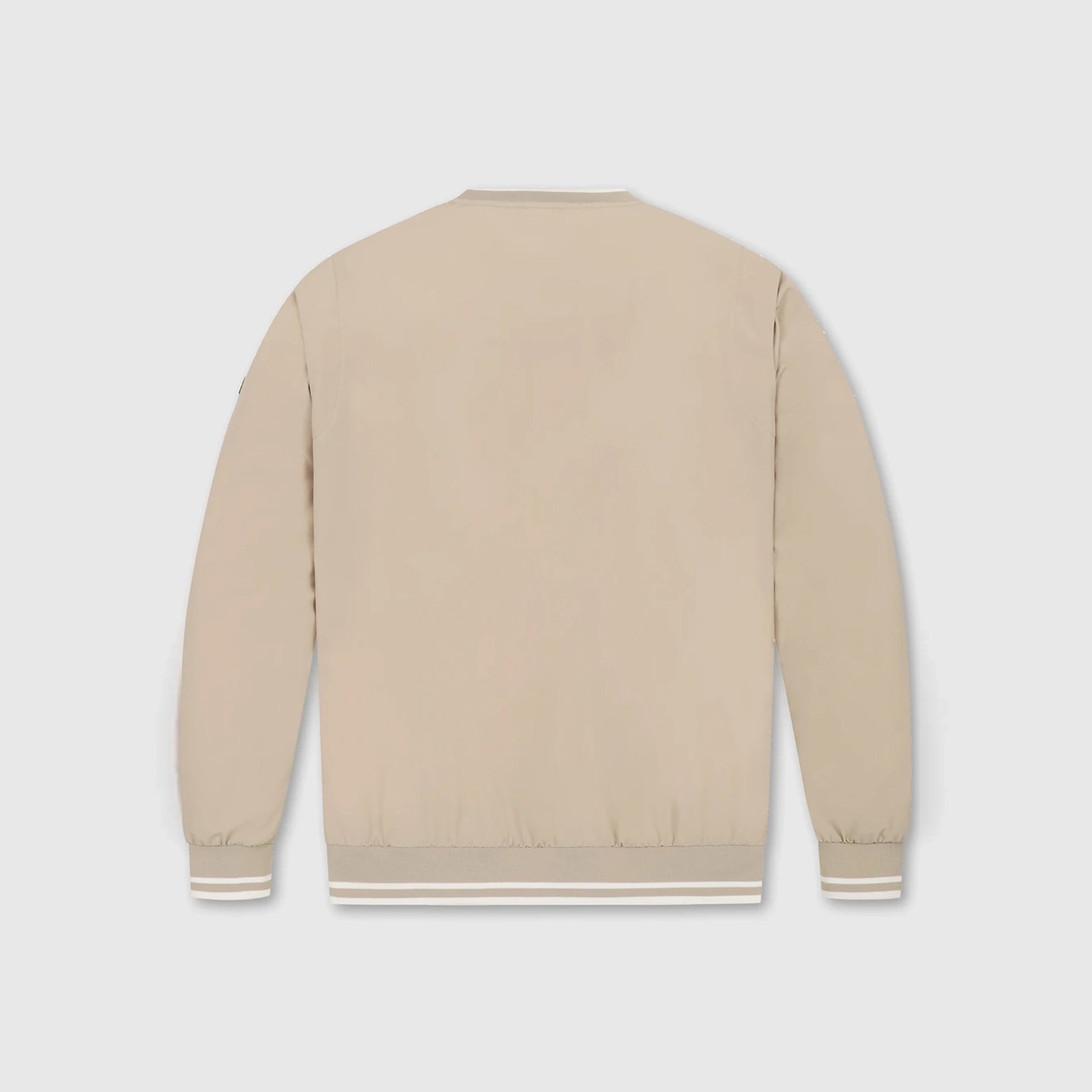 A light beige bomber jacket shown from the back, featuring ribbed collar, cuffs, and hem with thin white stripes, set against a light gray background.