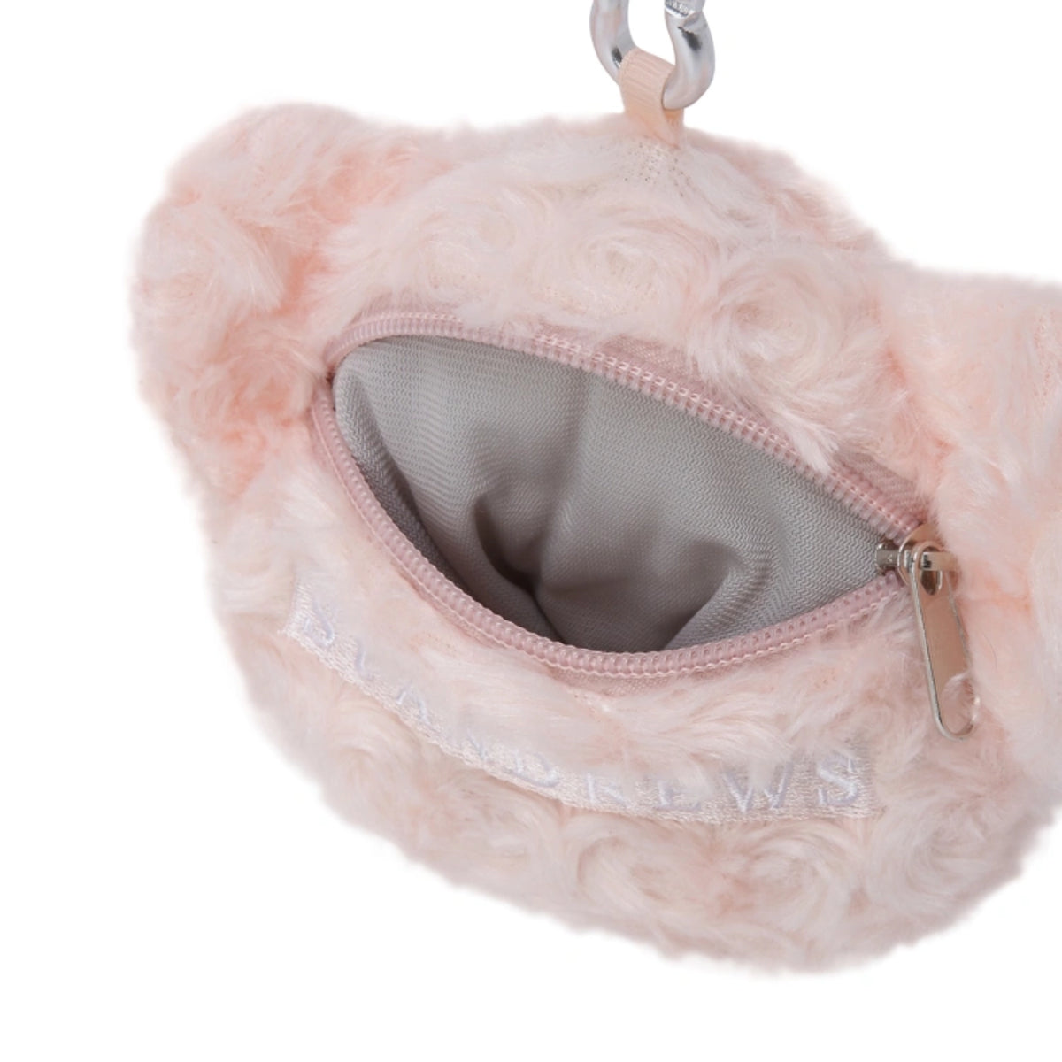A close-up of a light pink fluffy faux-fur pouch with a silver zipper and a silver metal clip at the top. The brand name 'St Andrews' is embroidered in white on the front.