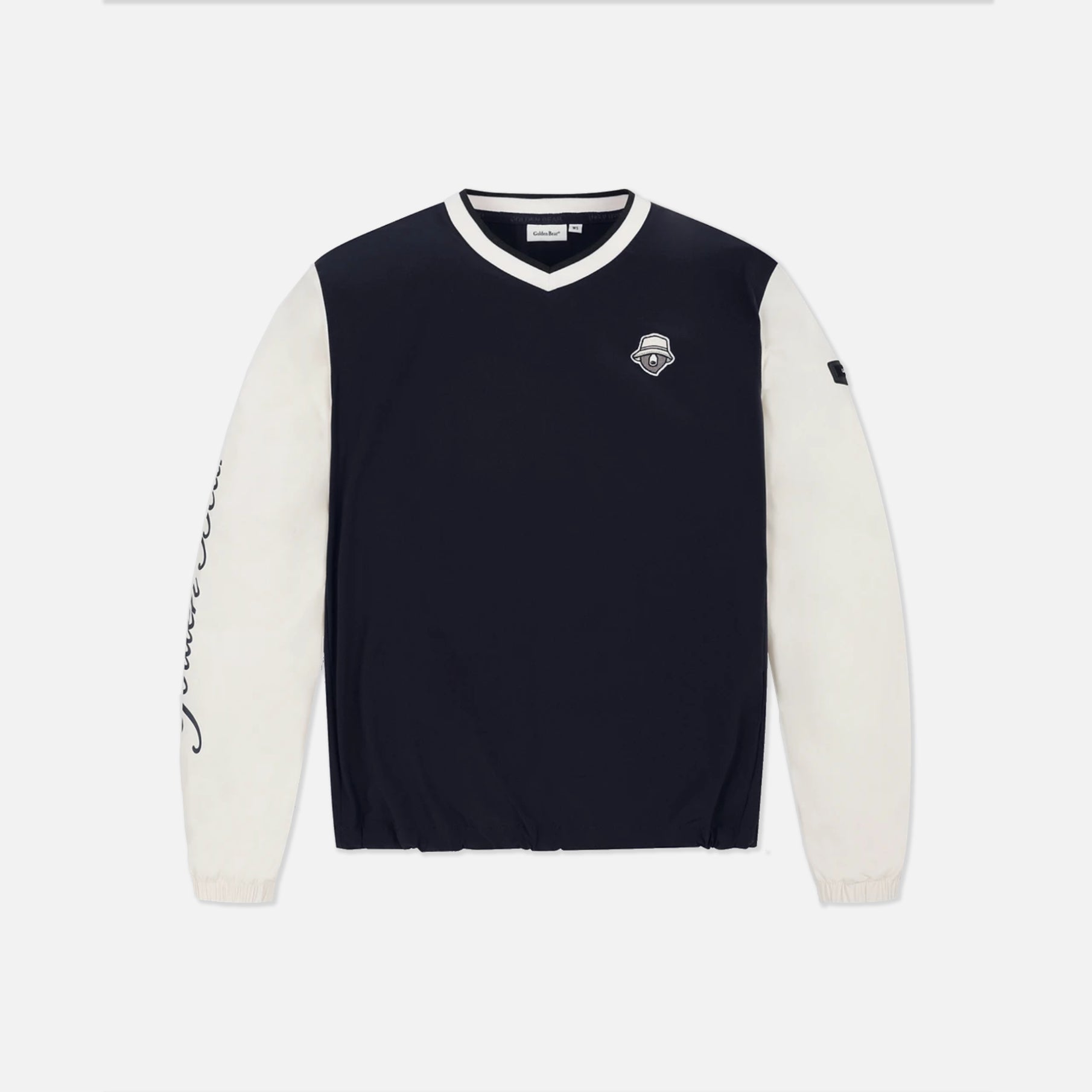 A long-sleeve V-neck pullover sweatshirt in navy blue with contrasting off-white sleeves and collar trim, featuring a small chest logo and a script graphic on one sleeve, shown against a light gray background.