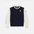 A long-sleeve V-neck pullover sweatshirt in navy blue with contrasting off-white sleeves and collar trim, featuring a small chest logo and a script graphic on one sleeve, shown against a light gray background.