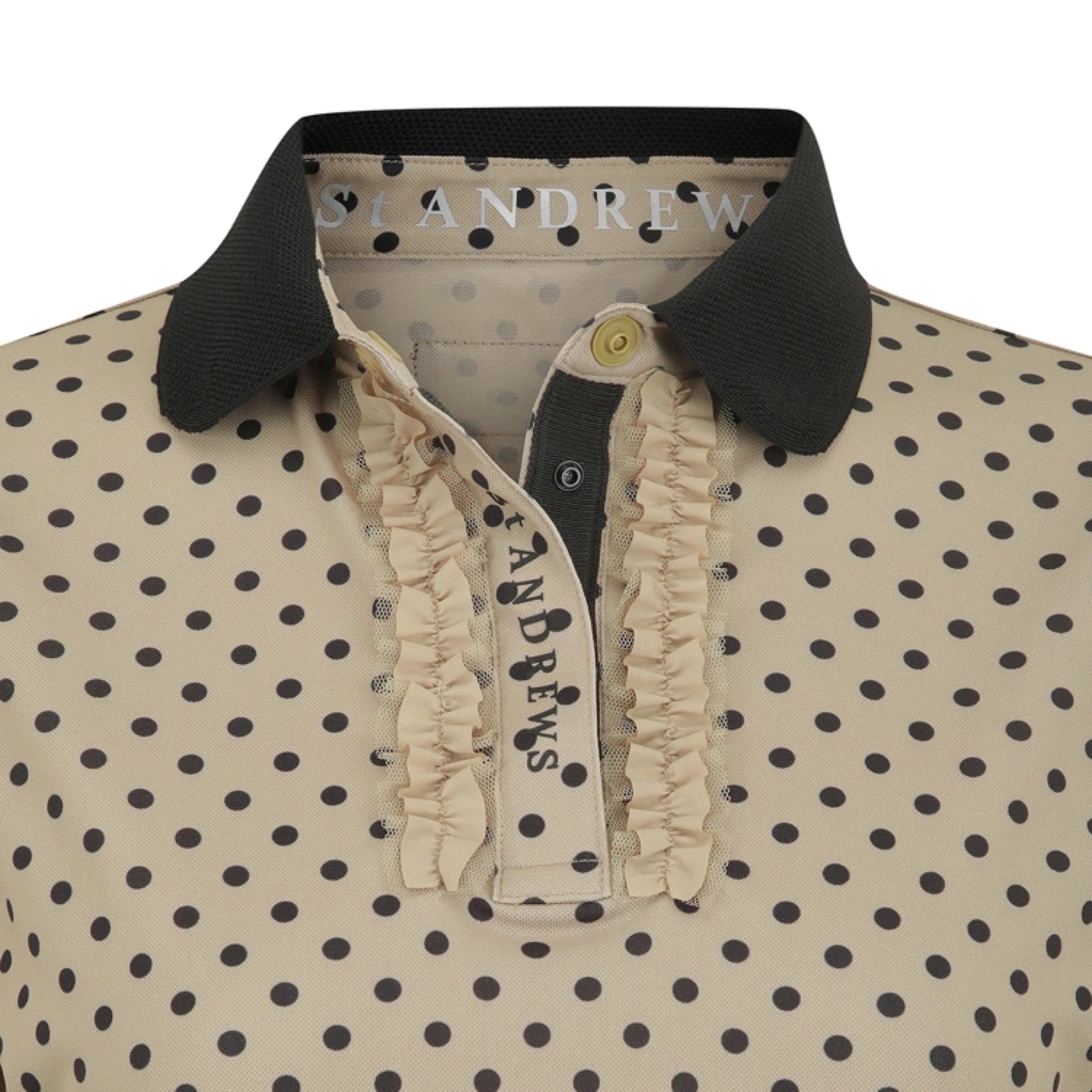 Close-up of a St. Andrew polo shirt featuring a beige and black polka dot pattern, a black ribbed collar, and a ruffled cream placket.