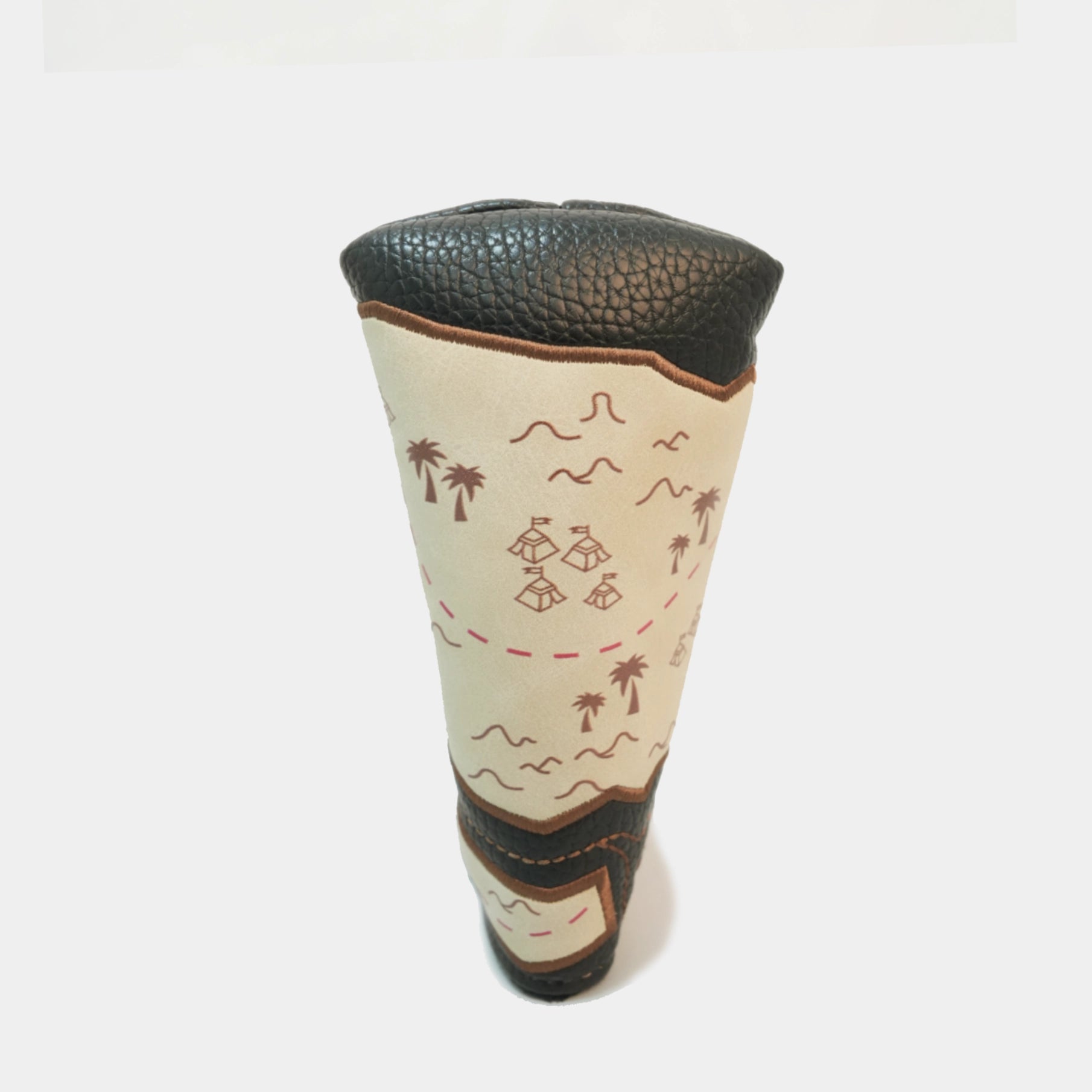 A golf club headcover with a cream-colored body featuring a brown map-style design with palm trees and ships, finished with textured black leather top and bottom sections.