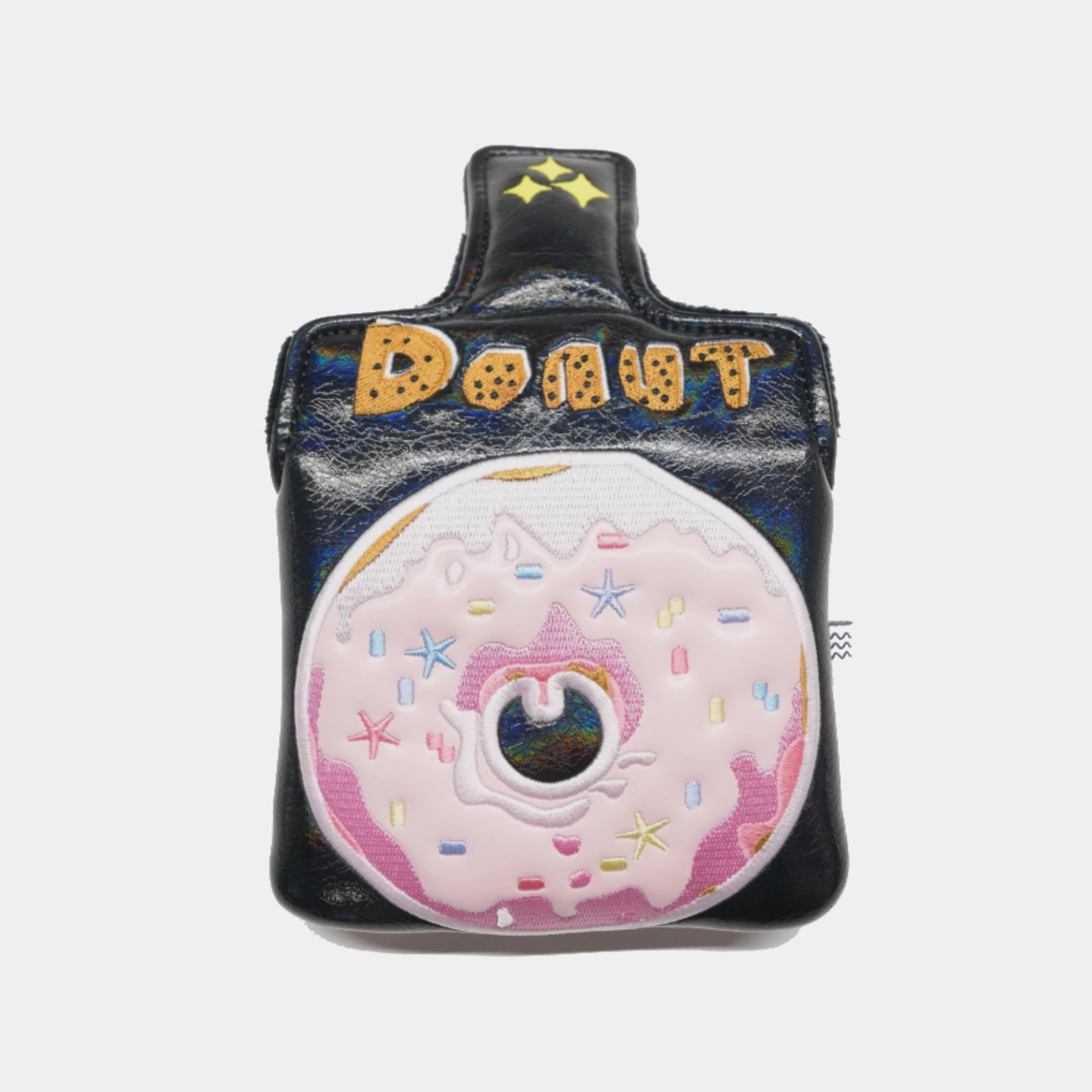 A black faux-leather mallet putter cover designed like a coffee cup, featuring a large pink donut with sprinkles on the front and the word 'DONUT' in gold letters on the handle.