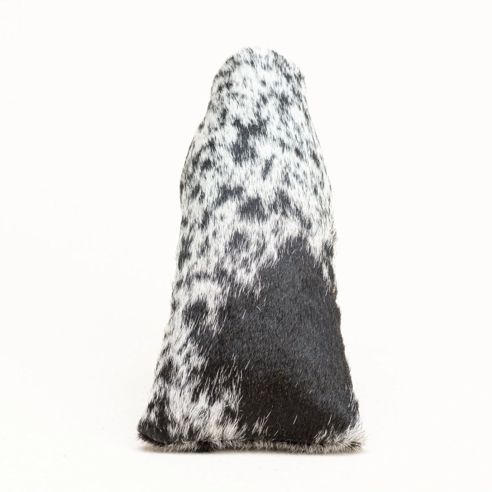 A putter cover with a black and white cowhide pattern, photographed against a solid white background.