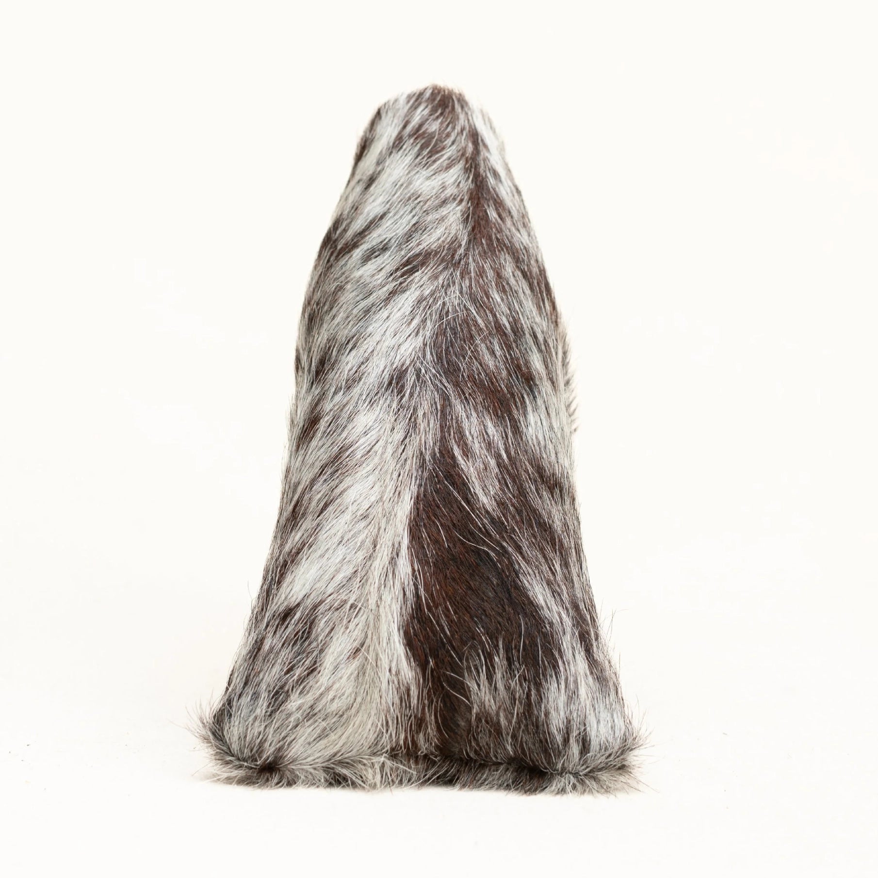 A putter cover with a mottled brown and white cowhide pattern, photographed against a solid white background.