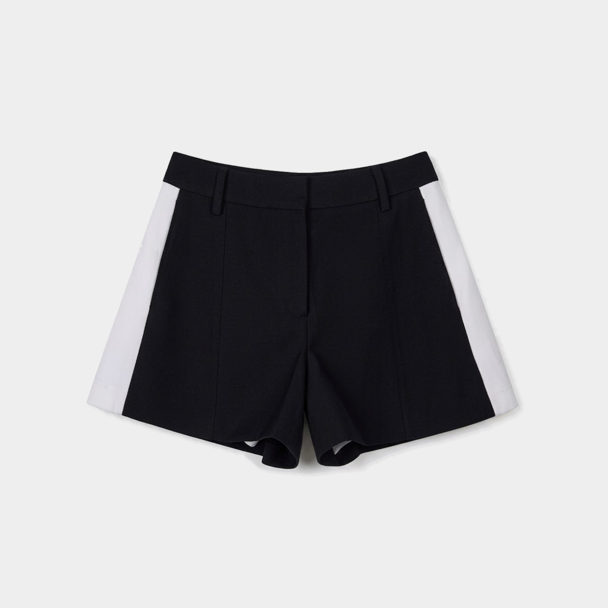 Black tailored shorts with contrasting white side panels, shown flat against a light gray background.