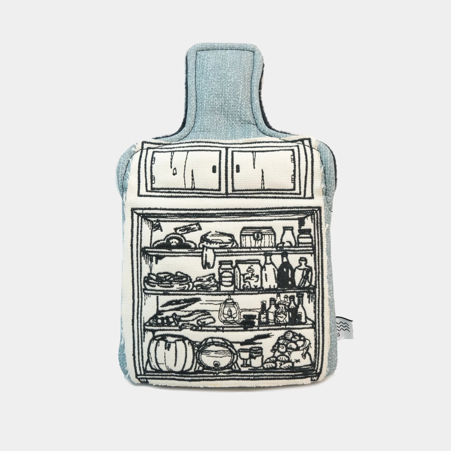 A fabric hot water bottle with a light blue denim-like body and a black line-art illustration of an open refrigerator on the front, shown against a plain light gray background.