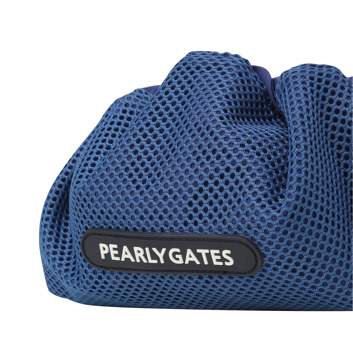 Close-up of a blue mesh drawstring bag with a black patch featuring the white text 'PEARLYGATES'.