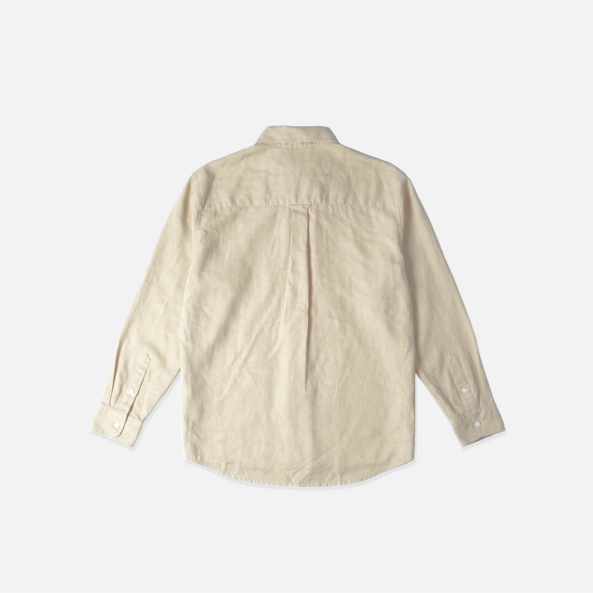 A light beige linen button-down shirt shown from the back, laid flat against a clean white background.