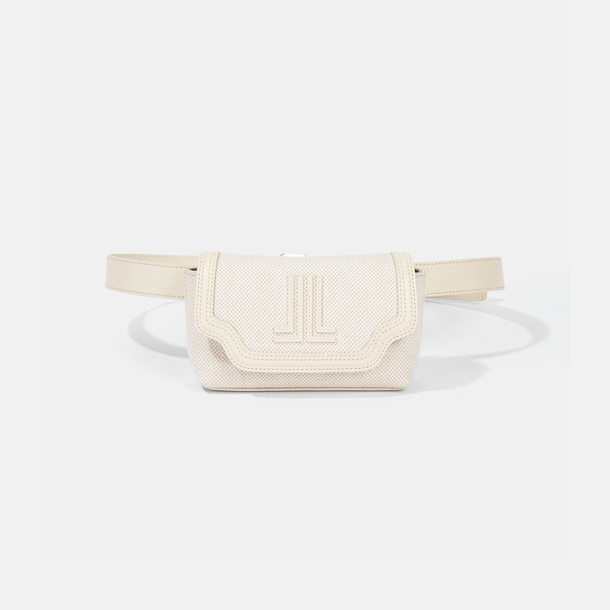 An off-white textured leather belt bag with a matching adjustable strap, featuring an embossed 'JL' logo on the front flap, set against a light gray background.