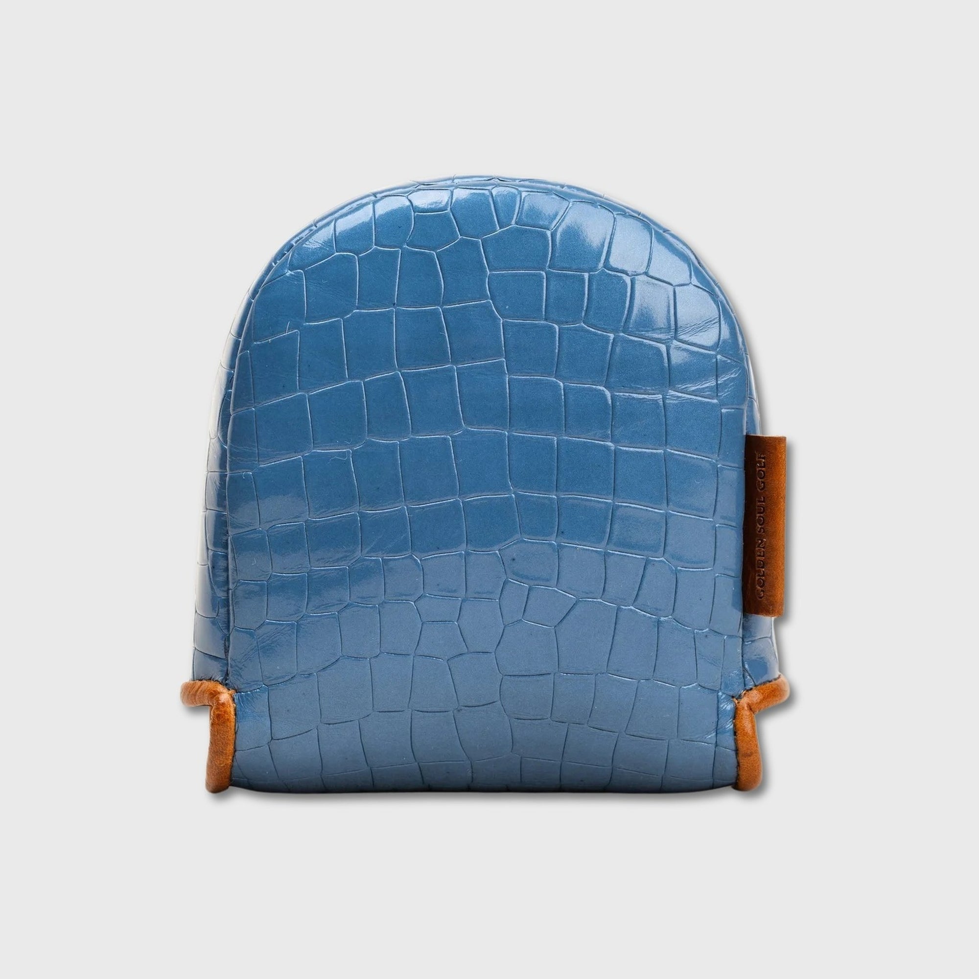 A blue crocodile-embossed leather DF3 putter cover with orange-brown leather trim and a small vertical brand tag on the side, shown against a light gray background.