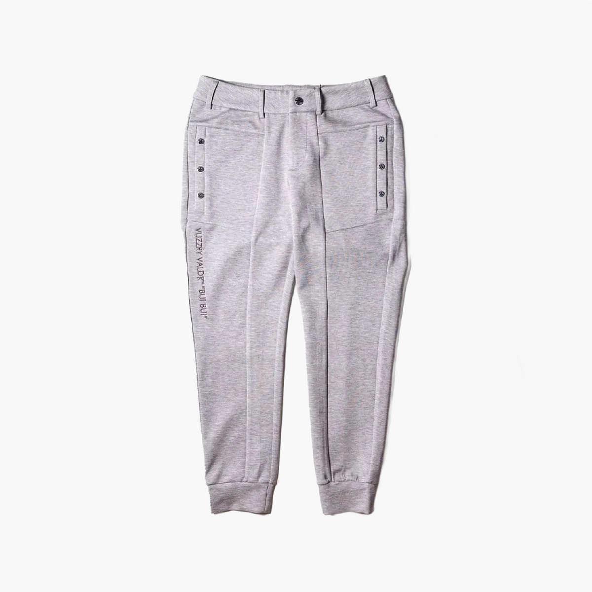 Light gray heather jogger pants featuring decorative button details on the side pockets and vertical text on the left leg, displayed flat against a white background.