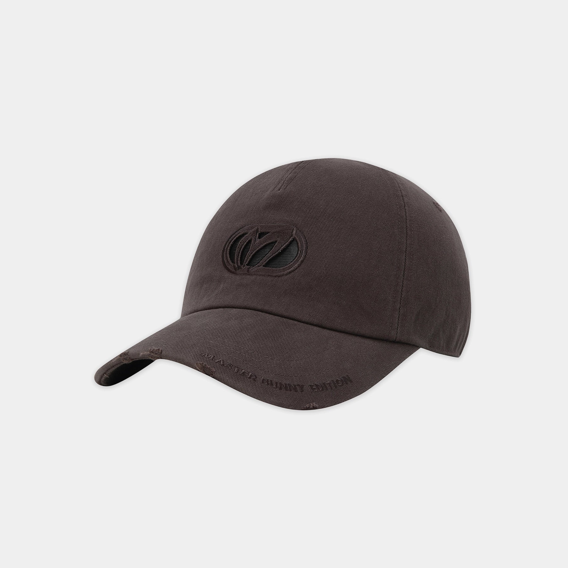 A dark brown baseball cap with a tonal black embroidered logo on the front and subtle text on the brim, shown against a light gray background.
