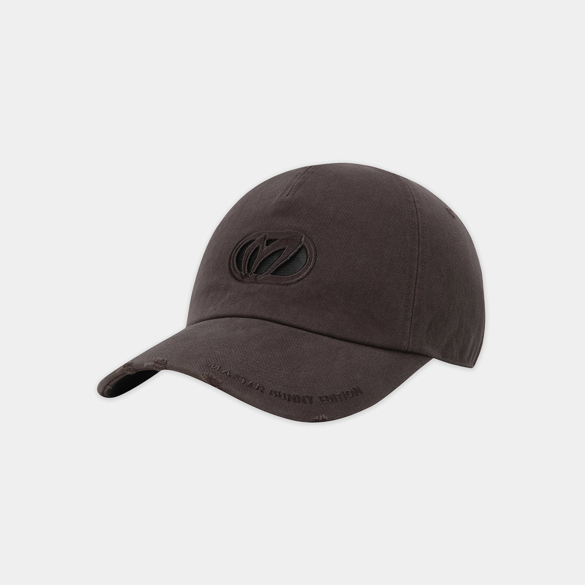 A dark brown baseball cap with a tonal black embroidered logo on the front and subtle text on the brim, shown against a light gray background.