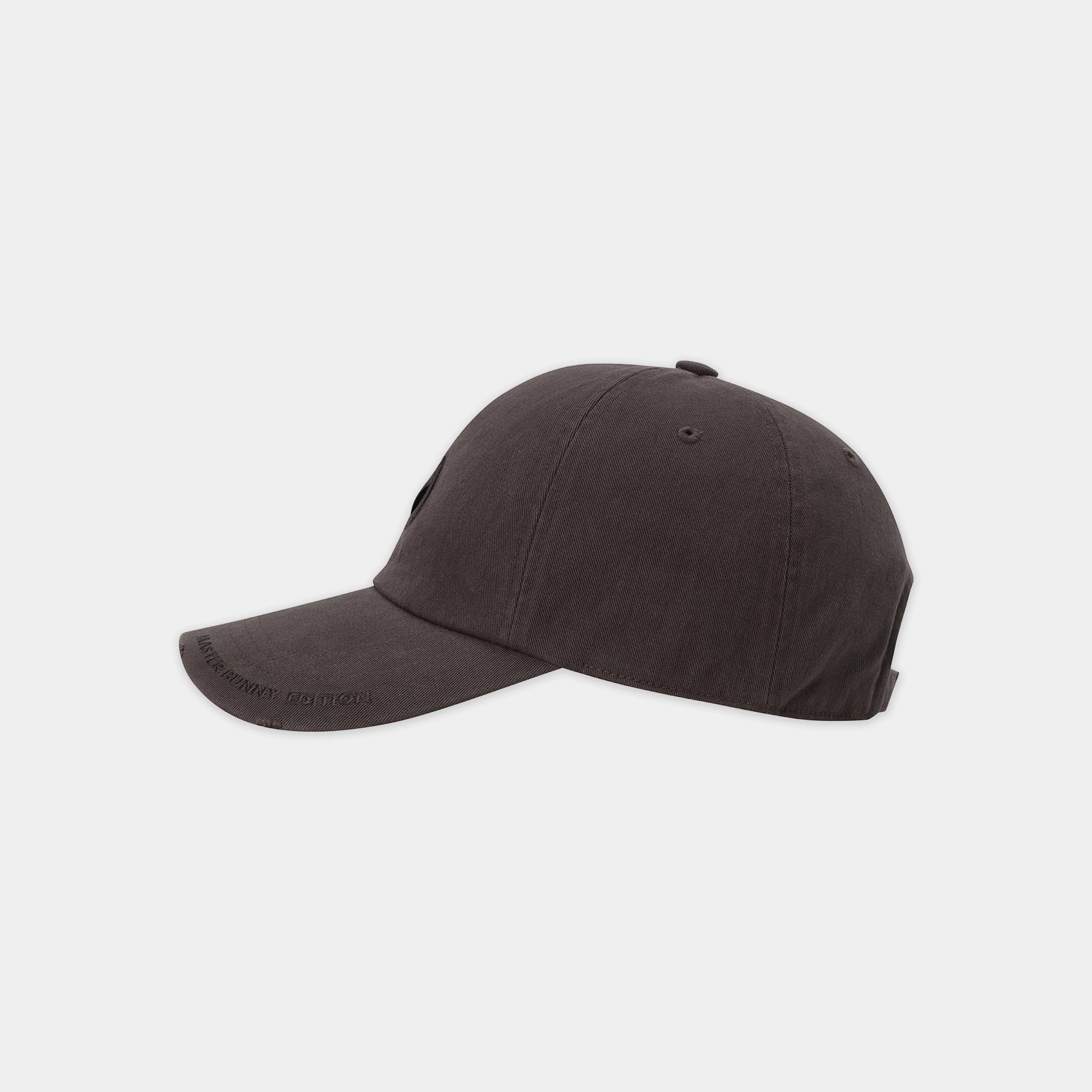 Brown baseball cap with a logo on a light gray background