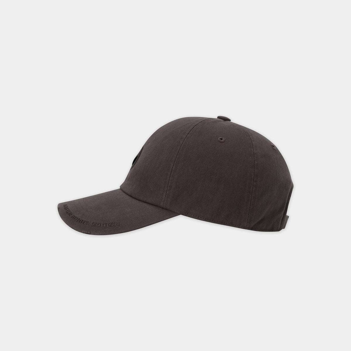 Brown baseball cap with a logo on a light gray background