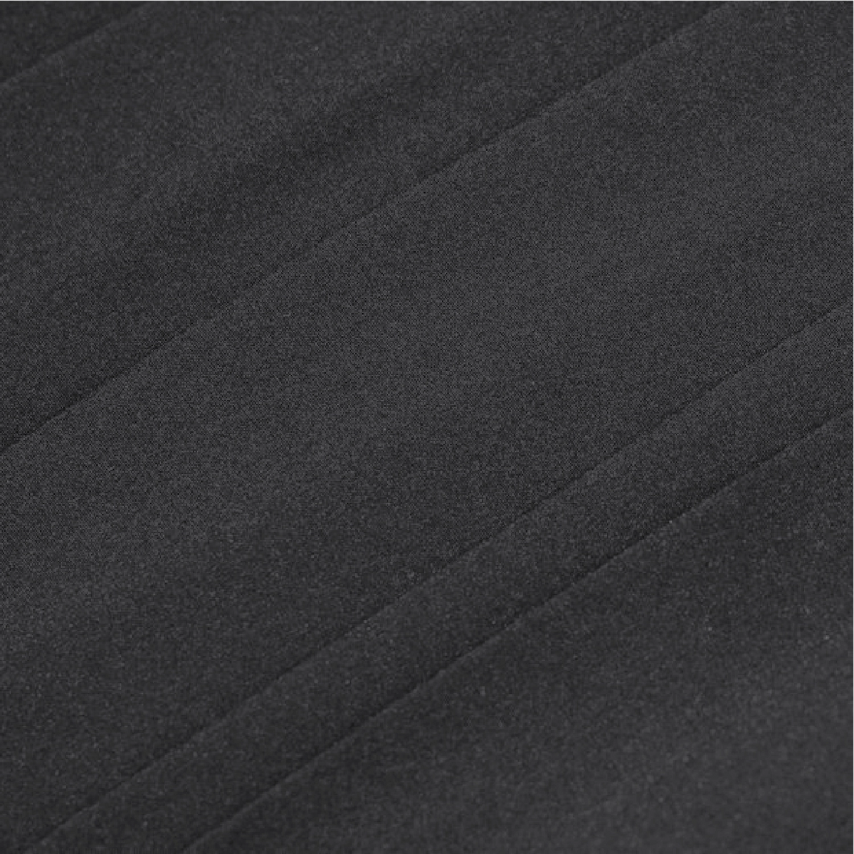 A close-up of dark charcoal gray fabric with a soft, slightly textured surface and subtle diagonal folds.
