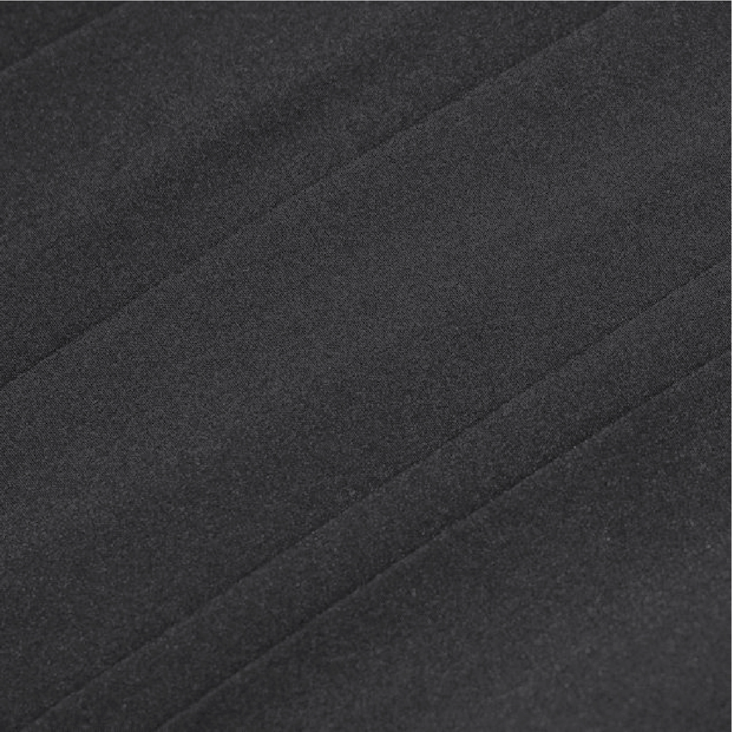 A close-up of dark charcoal gray fabric with a soft, slightly textured surface and subtle diagonal folds.