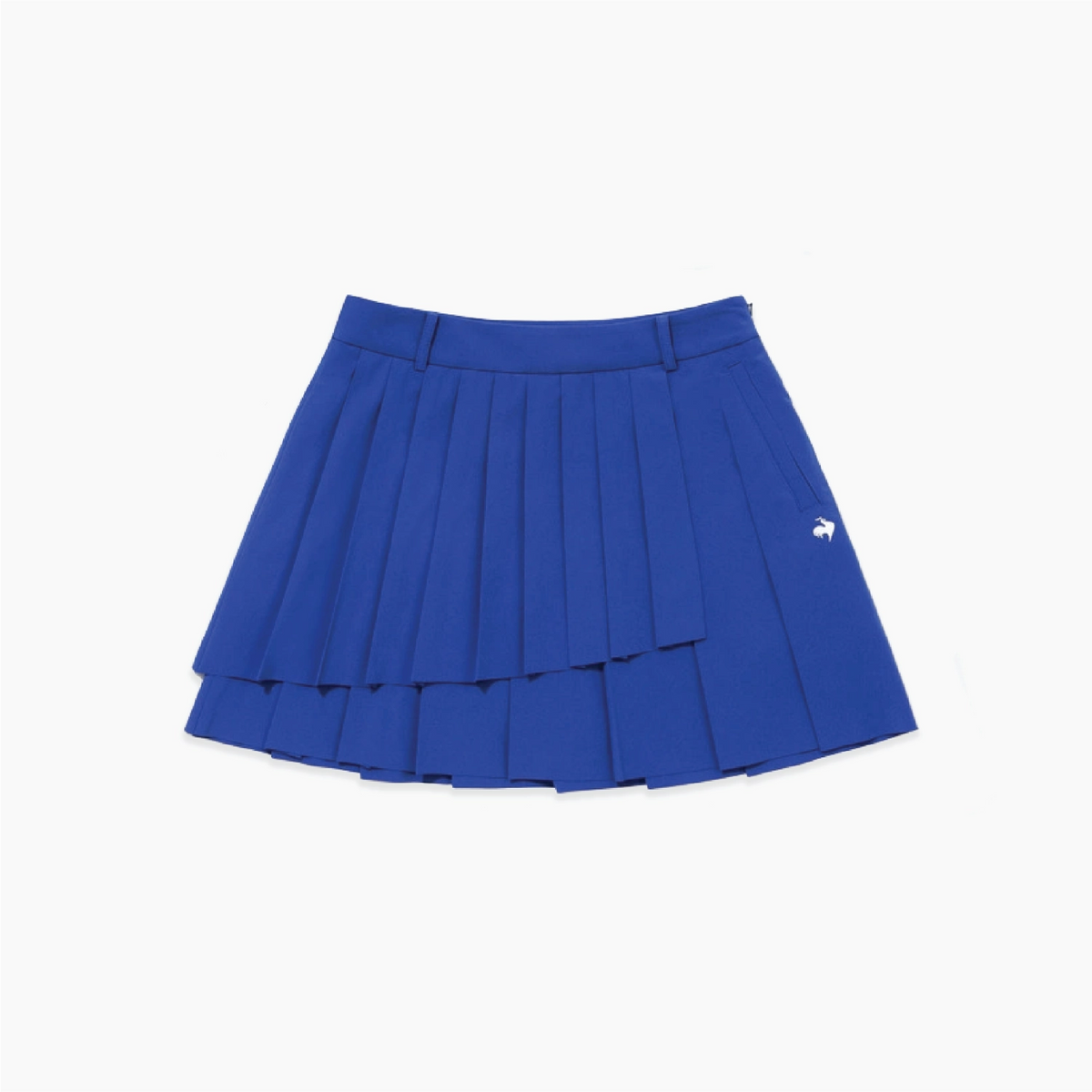 A royal blue pleated tennis skirt with a small white embroidered logo on the left side, displayed flat against a clean white background.